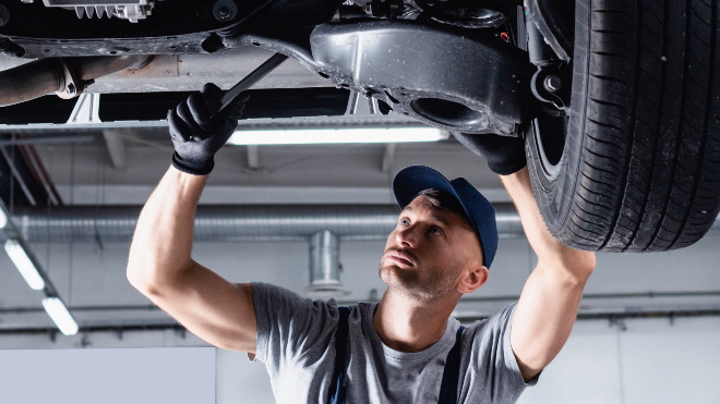 A mechanic working on a vehicle