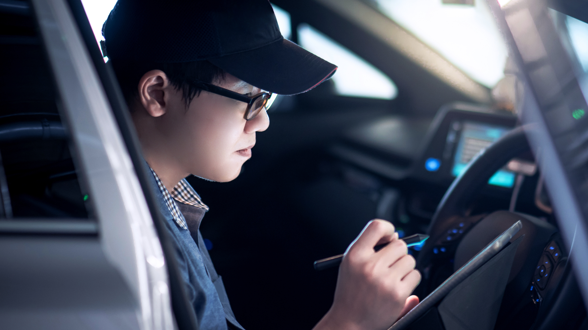 Delphi Technologies Expert calibrating an ADAS camera while sat at the steering wheel.