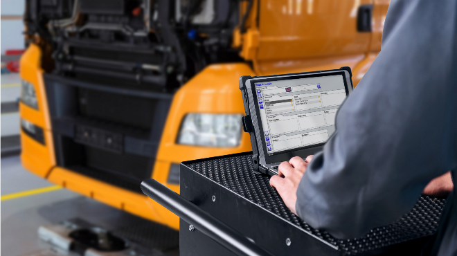 Technician using Delphi software to service a heavy duty vehicle.